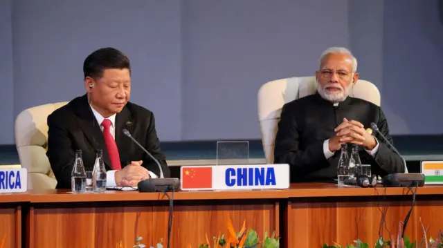 FILE PHOTO: Indian Prime Minister Narendra Modi and China's President Xi Jinping attend the BRICS summit meeting in Johannesburg, South Africa, July 27, 2018. REUTERS