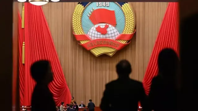 政协罕见大调整:易纲等十人去职引发三大猜想